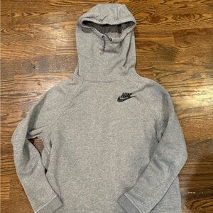 Women’s gray Nike sweatshirt. Neck warm on hood. Side pockets. Size large.